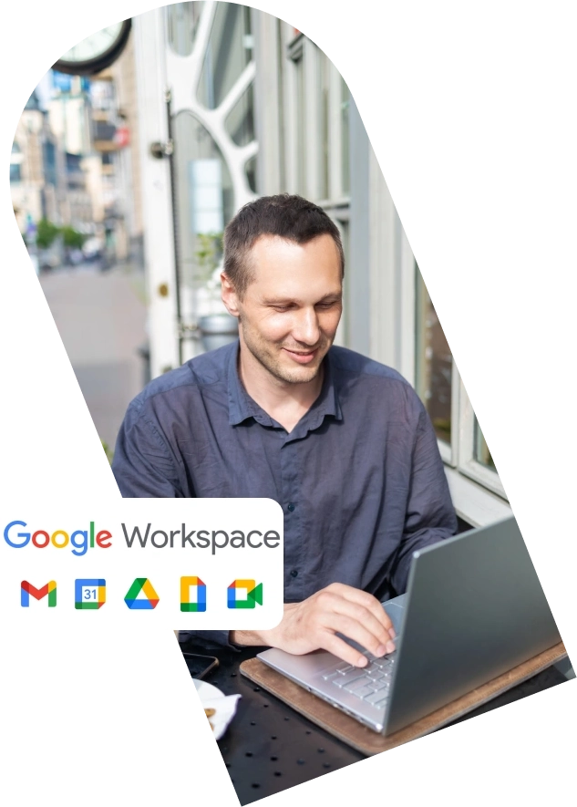Group 241 (1) Man working on a laptop with Google Workspace icons.
