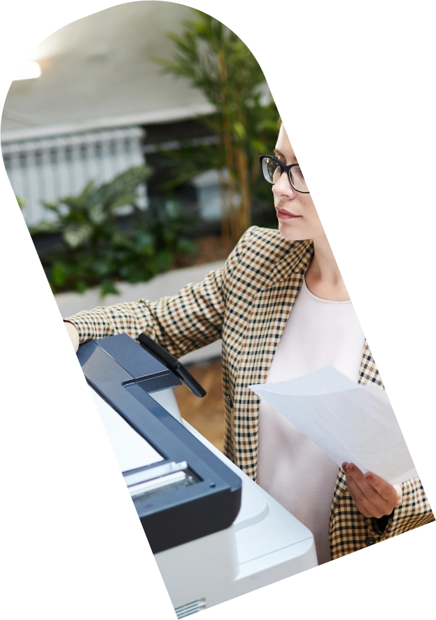 Mask group (20) Woman collecting a printout from a printer.