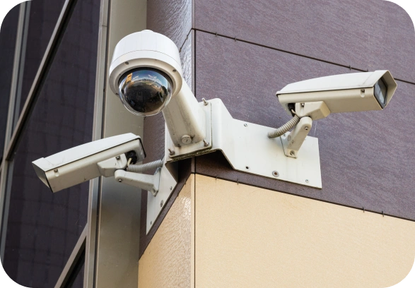image 37 CCTV cameras mounted on a building exterior.